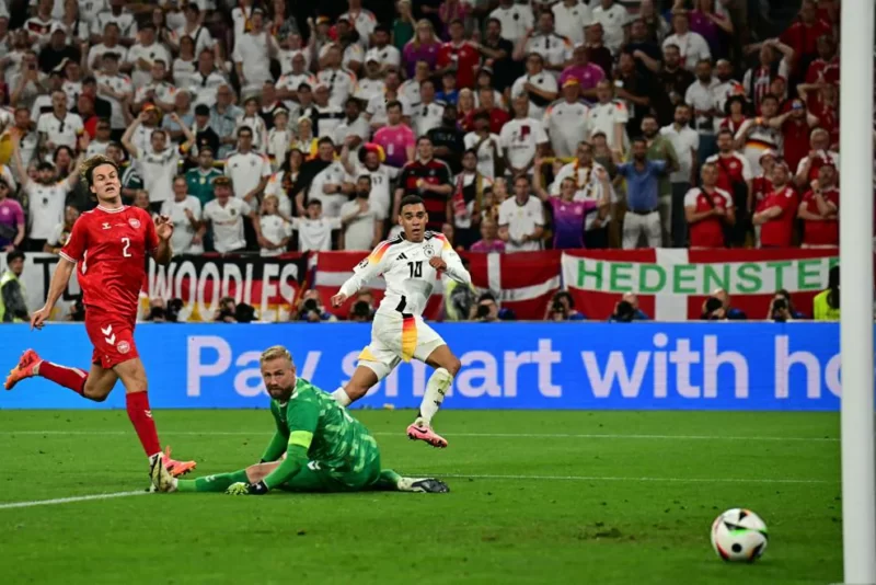 Jamal Musiala Gol menit ke-68 lewat apik ke sudut kanan gawang Denmark,  / Foto: X euro2024