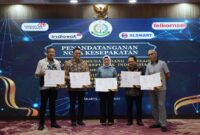JAM-Intel Reda Manthovani bersama pimpinan operator telekomunikasi menandatanganan nota kesepakatan di Aula Lantai 11 Gedung Utama Kejagung, Jakarta pada Selasa (24/6/2025).(Foto:IST)